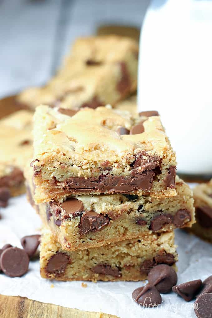 Blondie bars with chocolate chips and milk.
