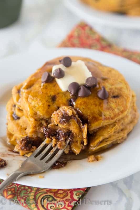 Pumpkin Chocolate Chip Pancakes - super light and fluffy pumpkin pancakes full with lots of chocolate chips and topped with maple syrup.