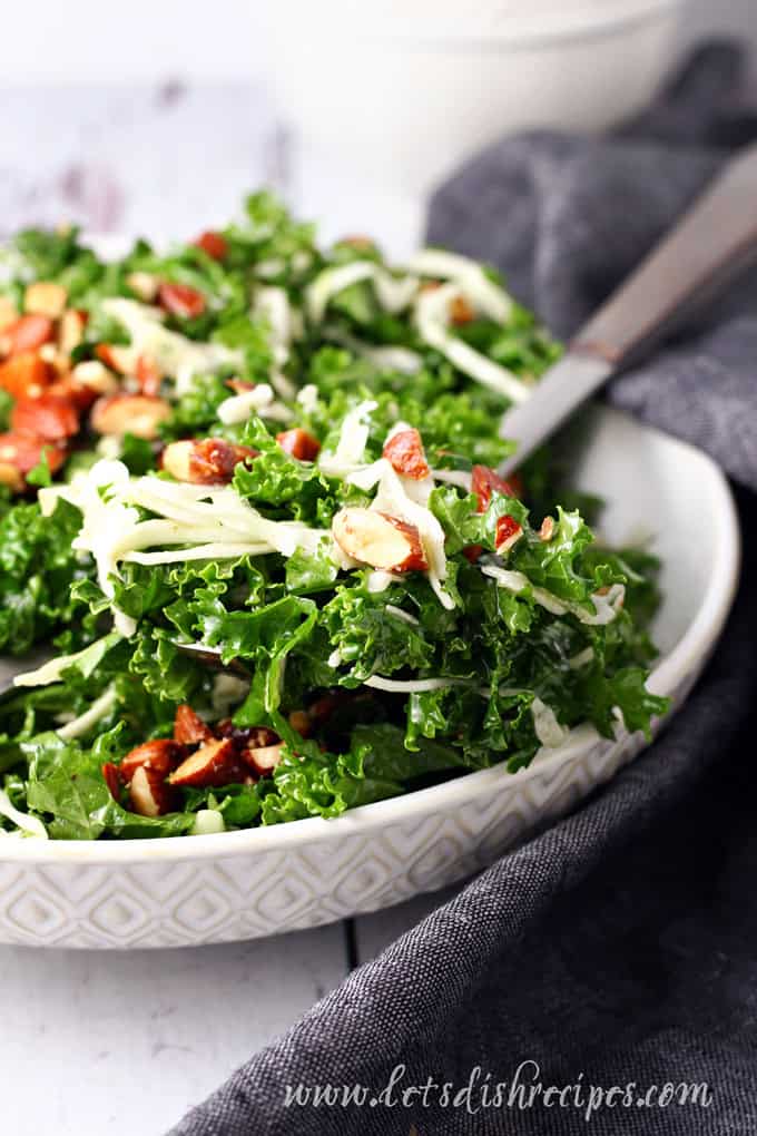 Chick-fil-A Kale Crunch Salad with kale, cabbage and almonds in a large bowl with spoon.