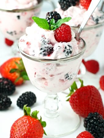 Dessert salad made with cream cheese, whipped cream and fresh berries.